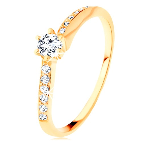 Zlatý prsten 585 - zvlněná zirkonová ramena, vystupující čirý zirkon - Velikost: 57