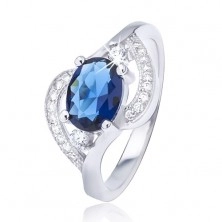 Stříbrný prsten 925 s oválným modrým zirkonem, zvlněná ramena
