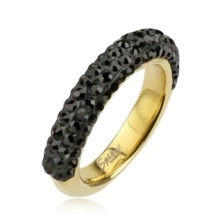 Ocelový prsten zlaté barvy zdobený černými zirkony