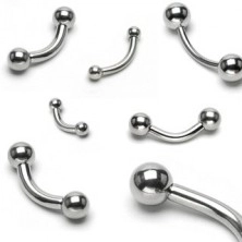 Ocelový piercing do obočí, mírně zaoblený, dvě kuličky, různé velikosti