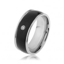 Lesklý ocelový prsten stříbrné barvy, černý vypouklý pás s čirým zirkonem
