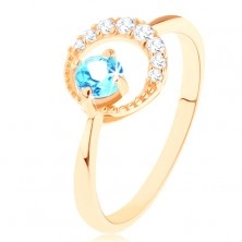 Zlatý prsten 375 - srpek měsíce zdobený čirými zirkonky, modrý topas