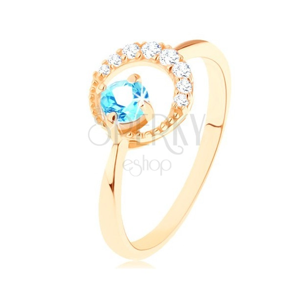 Zlatý prsten 375 - srpek měsíce zdobený čirými zirkonky, modrý topas