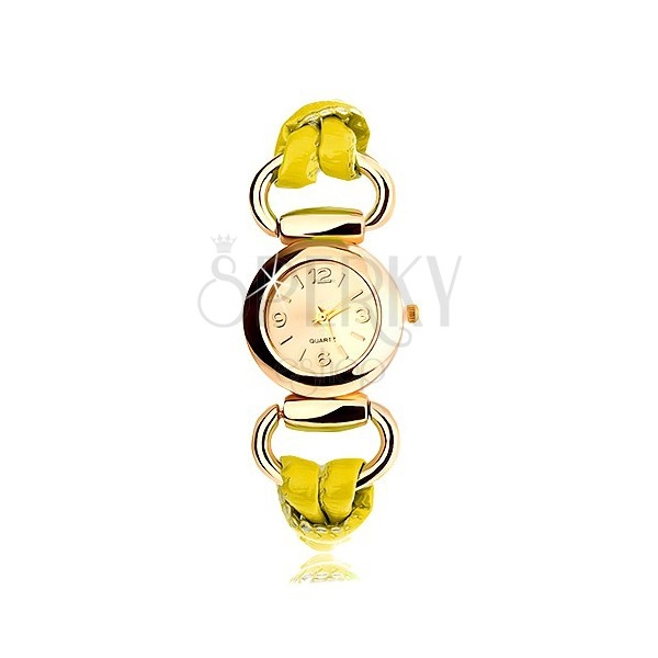 Náramkové hodinky, řemínek ze žlutého latexu, kulatý ciferník zlaté barvy