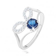 Stříbrný prsten 925, rozdělená ramena, čiré obrysy zrnek, tmavě modrý zirkon