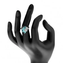 Lesklý prsten stříbrné barvy, čiré zirkony, zrnka v akvamarínovém odstínu