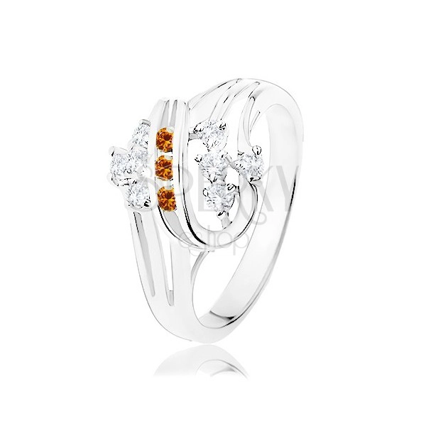 Prsten ve stříbrné barvě, dvojitá spirála s oranžovými a čirými zirkony
