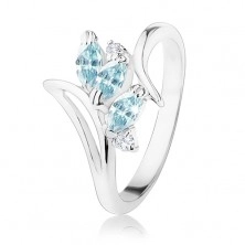 Prsten ve stříbrném odstínu, zahnutá ramena, světle modré a čiré zirkony