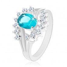 Lesklý prsten s rozvětvenými rameny, světle modrý zirkonový ovál, čiré oblouky