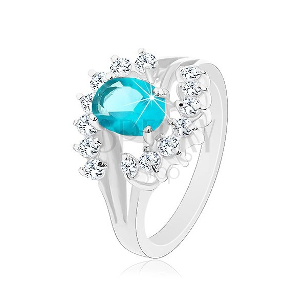 Lesklý prsten s rozvětvenými rameny, světle modrý zirkonový ovál, čiré oblouky