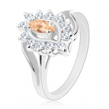 Třpytivý prsten ve stříbrném odstínu, světle oranžové zrnko, čiré zirkonky