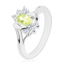 Prsten ve stříbrném odstínu, oválný světle zelený zirkon, oblouky, čiré zirkonky