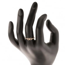 Prsten ze žlutého 14K zlata - symbol nekonečna zdobený čirými zirkonky