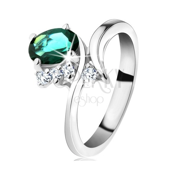Prsten ve stříbrné barvě, úzká ohnutá ramena, tmavě zelený oválný zirkon
