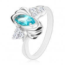 Lesklý prsten stříbrné barvy, barevné zrnko, trojice čirých zirkonků, obloučky