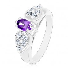 Prsten s rozšířenými rameny, čirá zirkonová mašlička s fialovým oválem