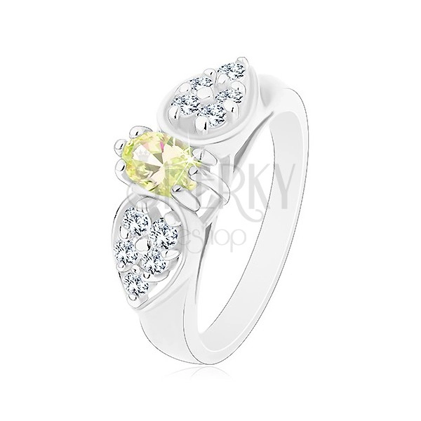 Lesklý prsten ve stříbrném odstínu, mašlička se světle zeleným oválem