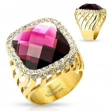 Mohutný ocelový prsten zlaté barvy, velký fialový zirkon s čirou obrubou, výřezy