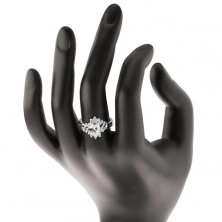Prsten stříbrné barvy, broušený barevný ovál, tenké oblouky a čiré zirkony