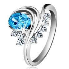 Prsten stříbrné barvy, zahnuté linie, barevný oválný zirkon a čiré zirkonky