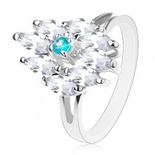 Prsten stříbrné barvy, akvamarínově modrý střed a čirá zrnka