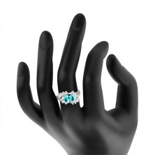 Prsten stříbrné barvy, zahnuté konce ramen, blýskavé čiré a barevné zirkony