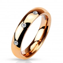Ocelový prsten růžovozlaté barvy - tři kulaté čiré zirkony, 4 mm