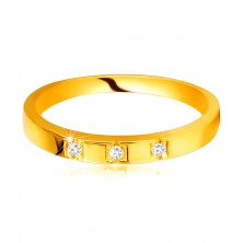 Prsten ze žlutého 585 zlata - lesklá ramena, tři třpytivé zirkony