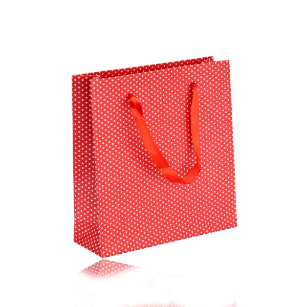 Levně Papírová dárková taštička - červená barva, bílé tečky, hladký povrch