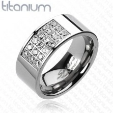 Prsten z titanu s obdélníkovým výřezem vykládaným zirkony