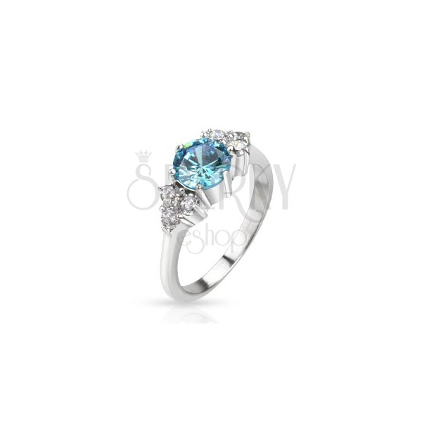 Prsten z oceli - vystouplý modrý zirkon uprostřed a čiré kameny